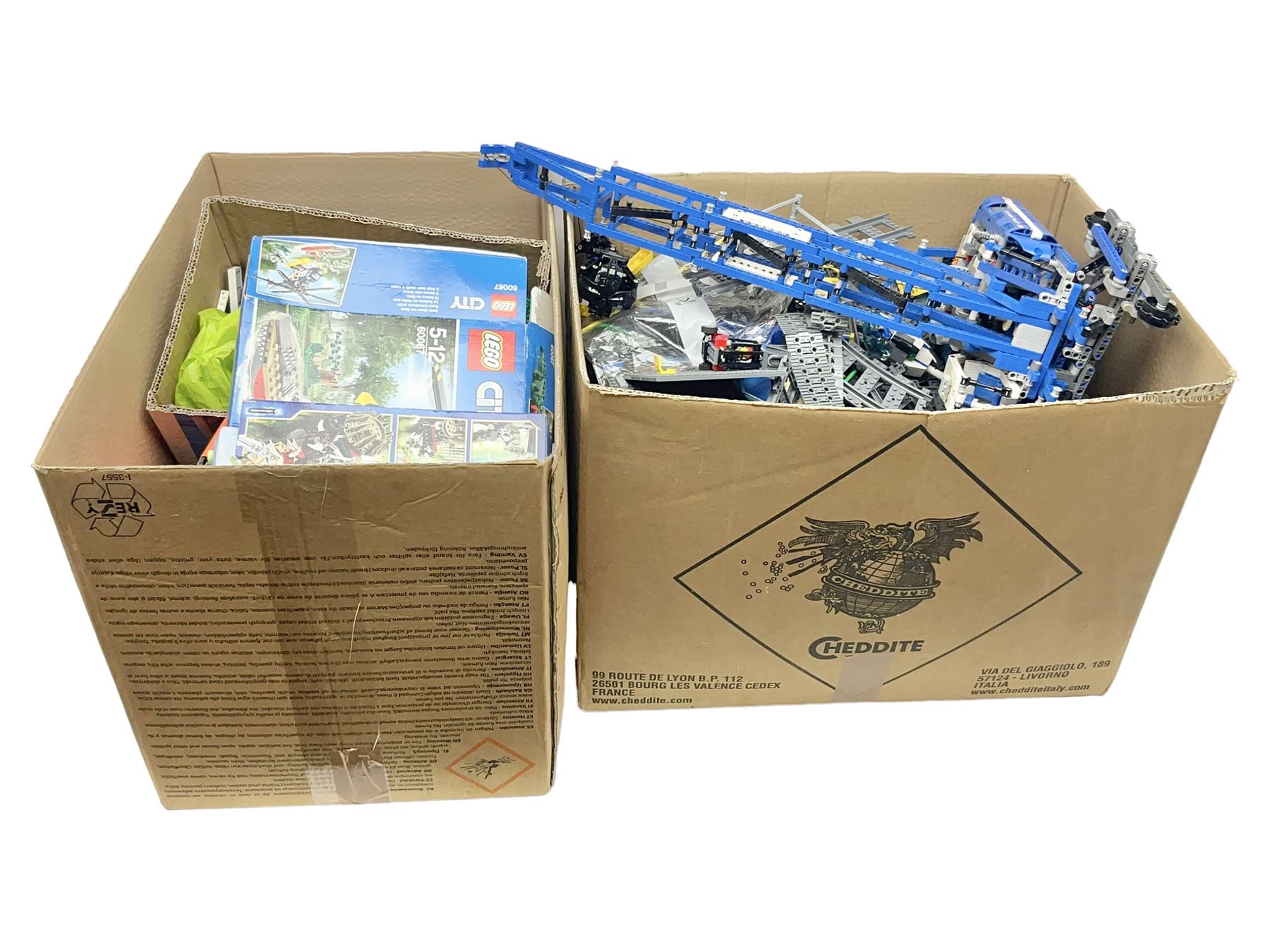 Very large collection of Lego, predominantly loose but some part constructed models, including Lego City, Lego Technic, Chima, Arctic 5, train set, mobile crane etc; together with numerous instruction booklets and some empty boxes; contained in two large cardboard boxes with gross weight of over 24kgs