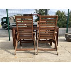 Rectangular teak drop leaf garden table, and four slatted armchairs
