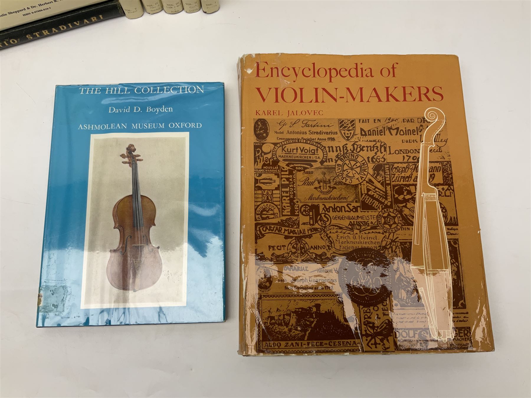 Fourteen books on violins and violin makers including Henley William: Universal Dictionary of Violin and Bow Makers. Five volumes. 1959/60. All first editions with dustjackets; Jalovec Karel: Encyclopaedia of Violin Makers. Two volumes. 1968. Vol.1 with d/j; Heron-Allen Ed.: Violin making As It Was, And Is. Two copies 1984 & 1991. Both with d/j; Henley W.: Antonio Stradivari. 1961; Fetis F.J.: Anthony Stradivari Celebrated Violin Maker. 1964 facsimile edition; Boyden David D.: catalogue of the Hill Collection of Musical Instruments in the Ashmolean Museum. 1979; and two others (14)