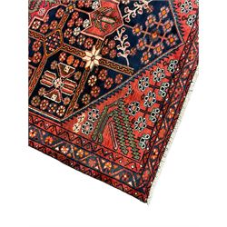 Persian Farahan rug, red and blue ground, the field divided into section with stylised flower head decoration, repeating border with overall floral design