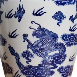 Pair of table lamps of baluster form, decorated with decorated with dragons chasing flaming pearls amongst clouds, on circular footed base,  H61cm including shades