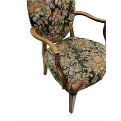 Pair of George III mahogany framed open armchairs, oval back and serpentine seat upholstered in fruit and foliage patterned fabric, shaped and moulded arms and arm supports, on square tapering moulded front supports 