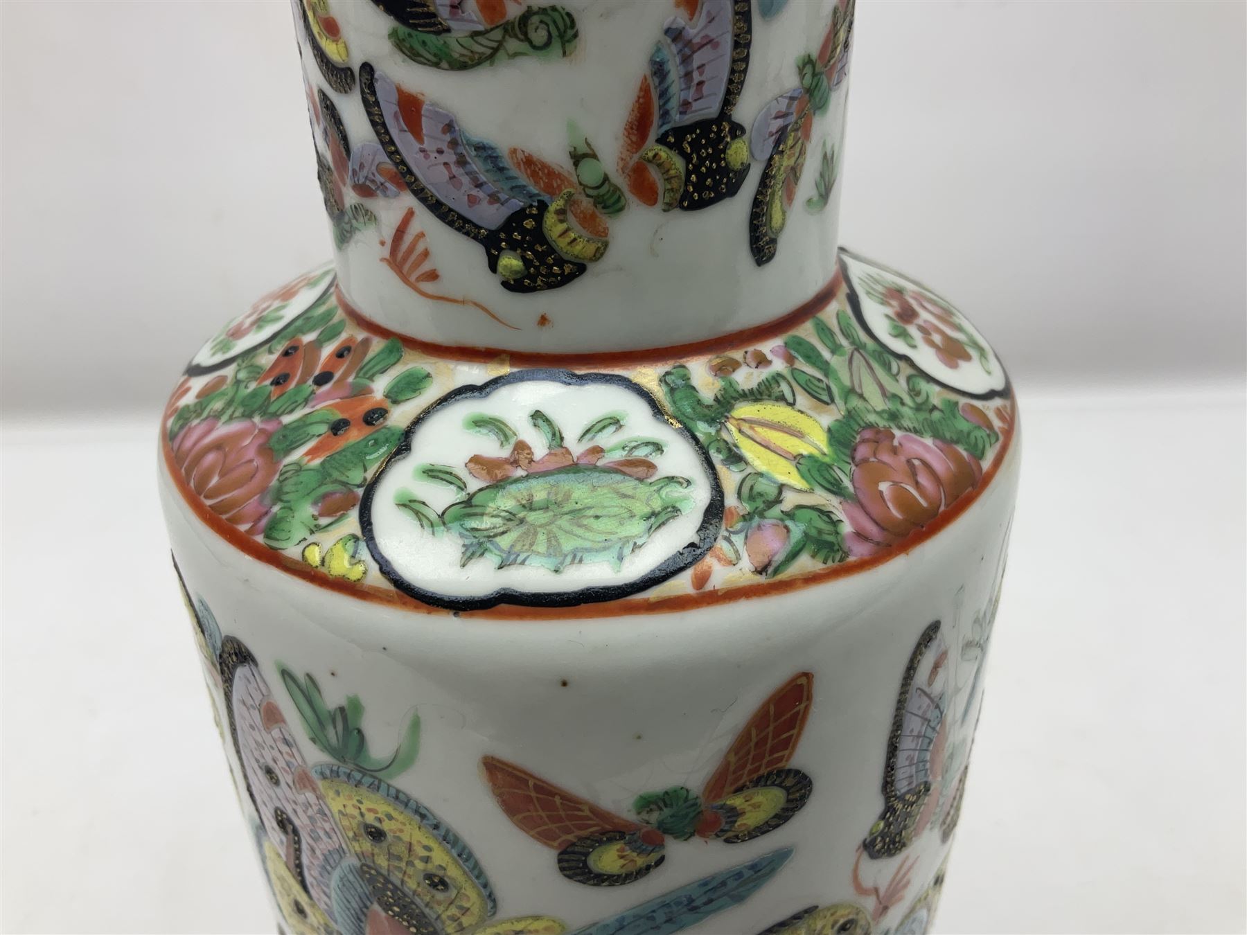 19th century Chinese Canton vase of slender baluster form, decorated with butterflies and floral panel to the neck, H30cm