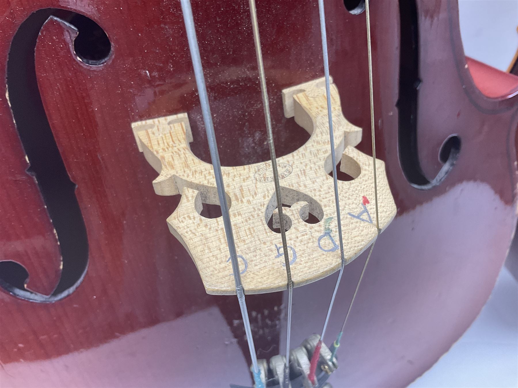 Two student half-size cellos - Boosey & Hawkes Artia with 65cm one-piece back and spruce top; bears maker's label; L104cm overall; and Romanian with 65.5cm two-piece maple back and ribs and spruce top; bears label; L108.5cm overall; each in soft carrying case with two bows (2)