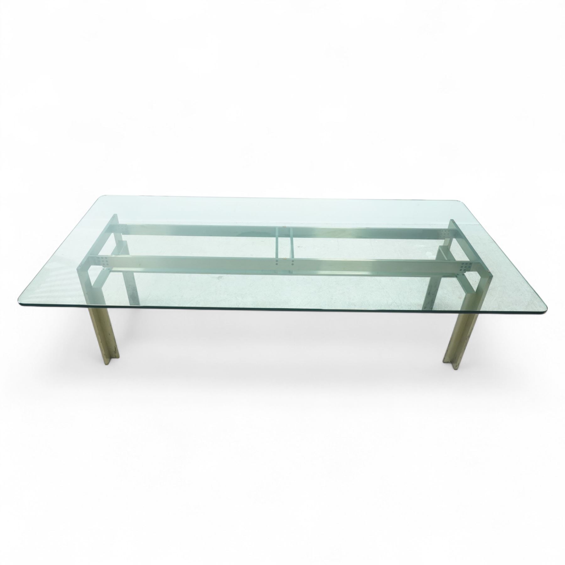 Carlo Scarpa for Studio Simon – 1970s Italian design dining table, the rectangular clear glazed top resting on a brushed steel and aluminium architectural base, with exposed bolt details and angled legs, maker's label with the designer's signature