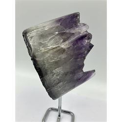 Amethyst crystal geode cluster, with large well-defined crystals, upon a metal stand, H21cm
