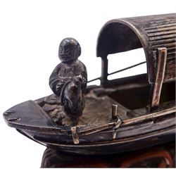 Chinese miniature silver model of a junk, with character mark to stern, mounted upon a carved wooden stand, overall H5cm L6.5cm