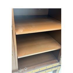 Chinese brown lacquered cocktail cabinet, decorated with gilt scenes of a traditional landscape with figures, pagodas, and mountainous scenery, double doors opening to reveal fitted interior with mirrored back, wine rack, shelves and cupboard, raised on square supports