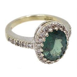 18ct gold oval green stone and diamond cluster ring, with diamond set shoulders by Lorique, hallmarked