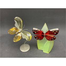 Swarovski Crystal flowers and butterflies, to include two tulip displays on stands, three vases of flowers and eight coloured butterflies, etc 