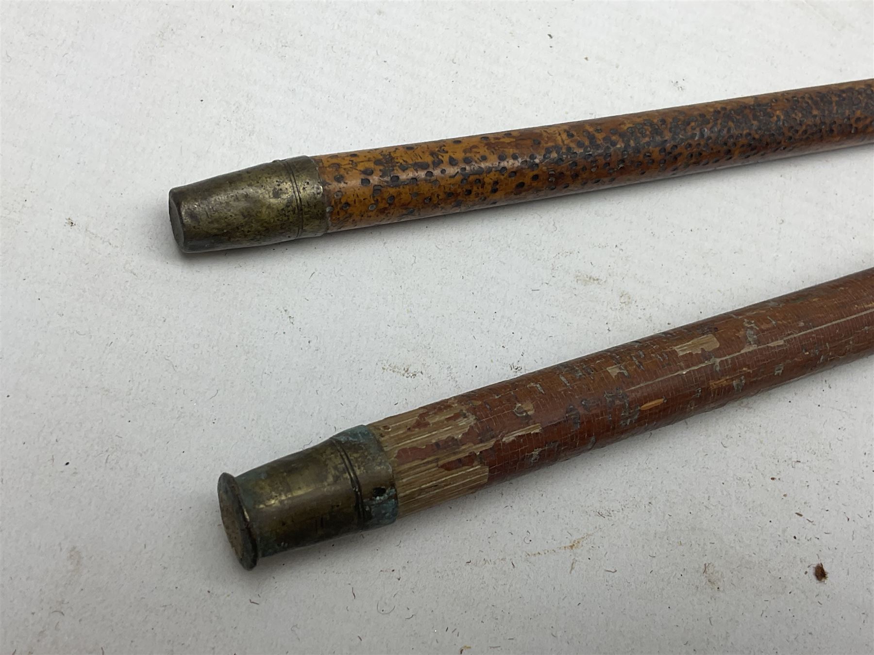 George V 1897 pattern Army Officer's sword by Henry Wilkinson Pall Mall London, the 82.5cm 'London Made' blade etched to both sides with Royal Crests and cyphers etc, pierced half-basket hilt with wire-bound fish skin grip and remains of leather knot strap; in leather covered field service scabbard L101cm overall; and two 14th Prince of Wales Own swagger sticks (3)