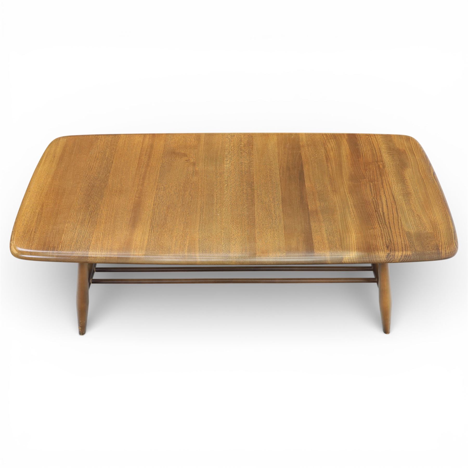 Ercol - Dark elm coffee table, plank top with chamfered edges, over a central under tier spindles, tapered legs 