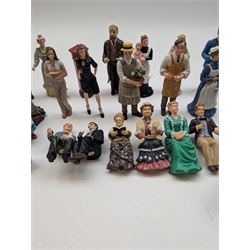 1:12 scale dolls house composite figures, including policeman, postman, maid, sitting and standing people in various styles of dress, etc
