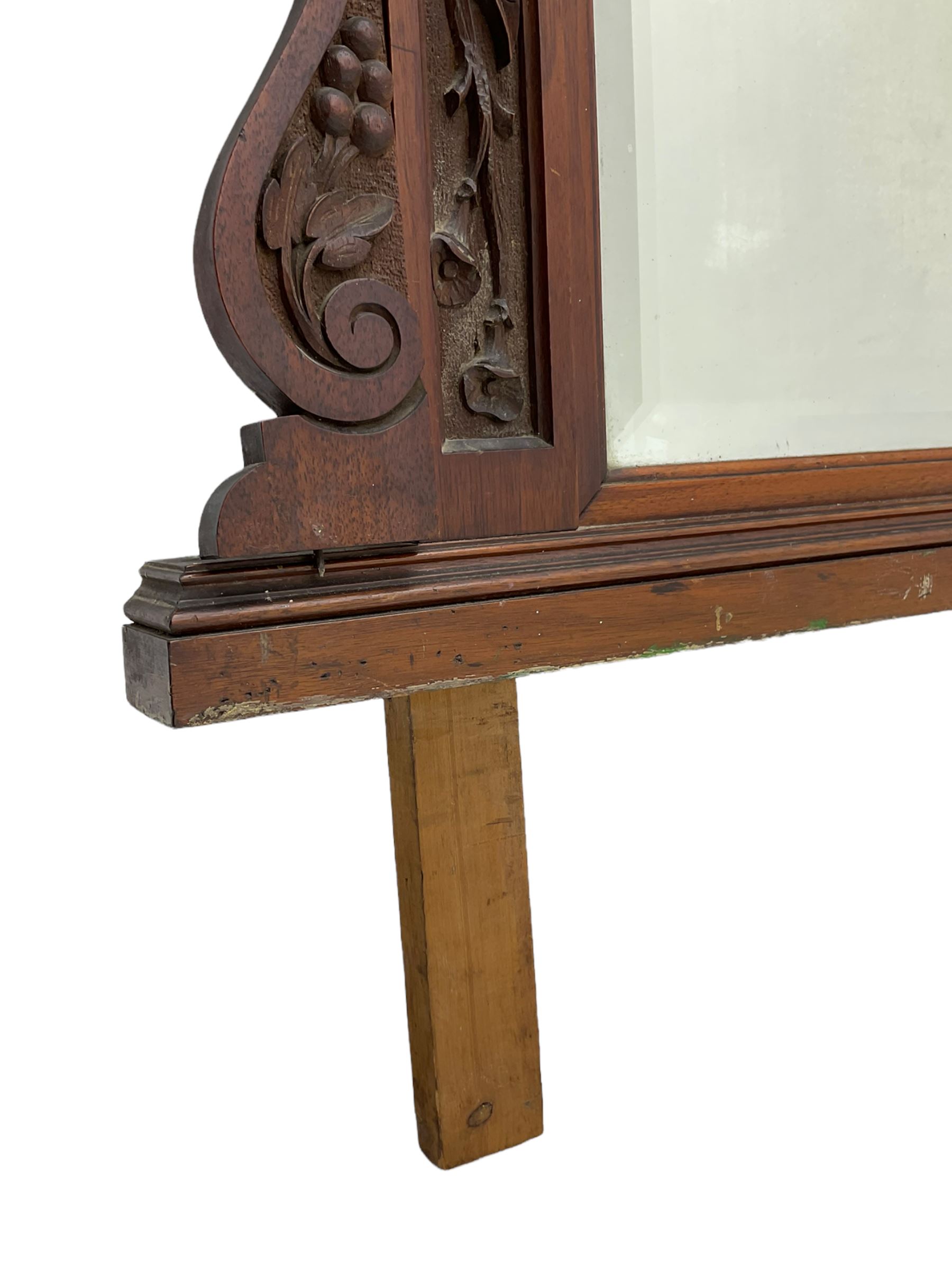 Edwardian walnut over-mantle mirror, bevelled plate