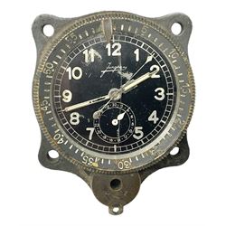 WW2 Jungans Luftwaffe aircraft cockpit clock with luminous centre sweep seconds hand, baton hour and minute hands, regulation 45mm black dial with date recorder, formerly illuminous Arabic numbers and minute track, rotating bezel (seized), going barrel movement with a lever escapement serial No 22901 jewelled to the centre wheel, over-sprung balance with timing  screws, max.H8cm