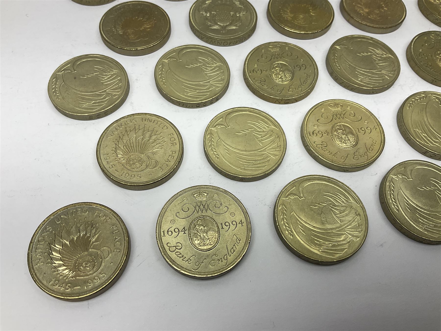 Twenty-eight Queen Elizabeth II old style two pound coins, including 1994 'Bank of England' etc