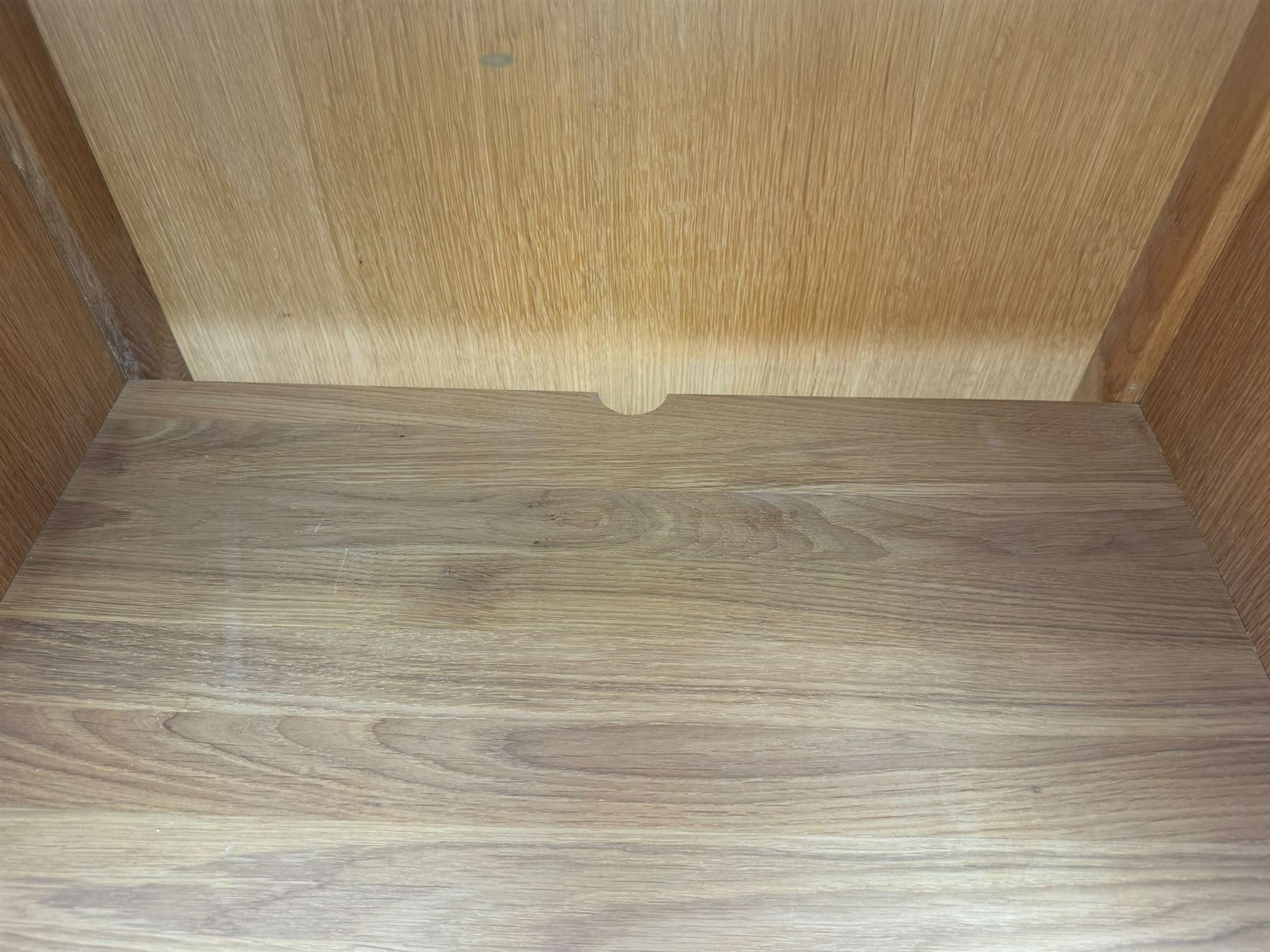 Laura Ashley - contemporary Milton oak display cabinet, featuring single door with two glass panels and pewter effect handle, enclosing one fixed oak shelf and two adjustable glass shelves, access hole at the bottom shelf, over single drawer with matching handle, on square legs