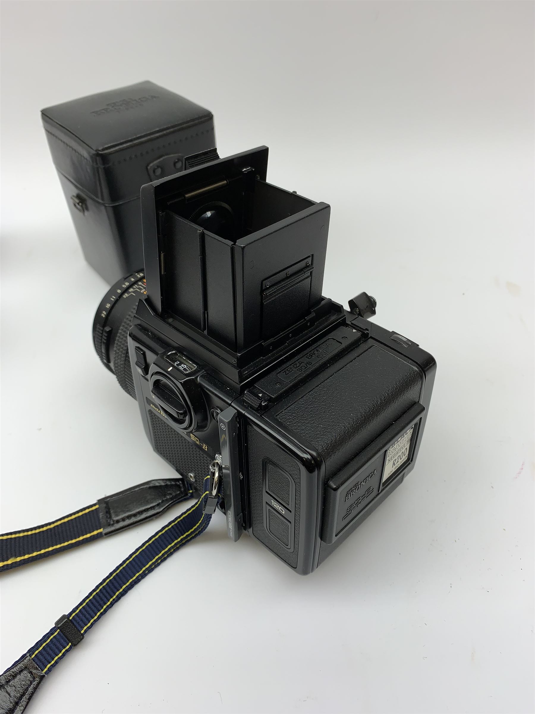 'Zenza Bronica SQ-B' camera fitted with 'Zenza Bronica Zenzanon-PS 1:28 f=80mm' lens, 'Zenza Bronica Zenzanon-PS 1:4 f=150mm' lens and 'Zenza Bronica Zenzanon-S 1:35 f=50mm' lens, with an instruction booklet