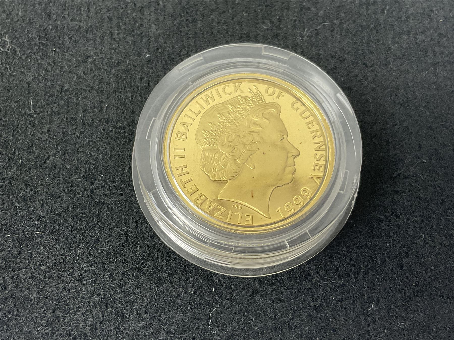 Single owner lifetime collection of mostly commemorative modern World coins with gold, silver and base metal examples, including two Queen Elizabeth II Bailiwick of Guernsey twenty-five pound gold coins 'The 1999 Royal Wedding' and '100th Anniversary of the End of the Victorian Era' 2001 each in 24 carat gold weighing 7.81 grams with certificates, silver coins commemorating the Millennium 2000 including Guyana sterling silver proof two-thousand dollars, Fiji sterling silver proof five dollars etc, silver coins from the Queen Elizabeth II Golden Jubilee Collection dated either 2002 or 2003 from Great Britain and the Commonwealth countries, United Kingdom commemorative crowns in card folders, The Royal Mint United Kingdom 1997 proof coin set in red folder without certificate etc