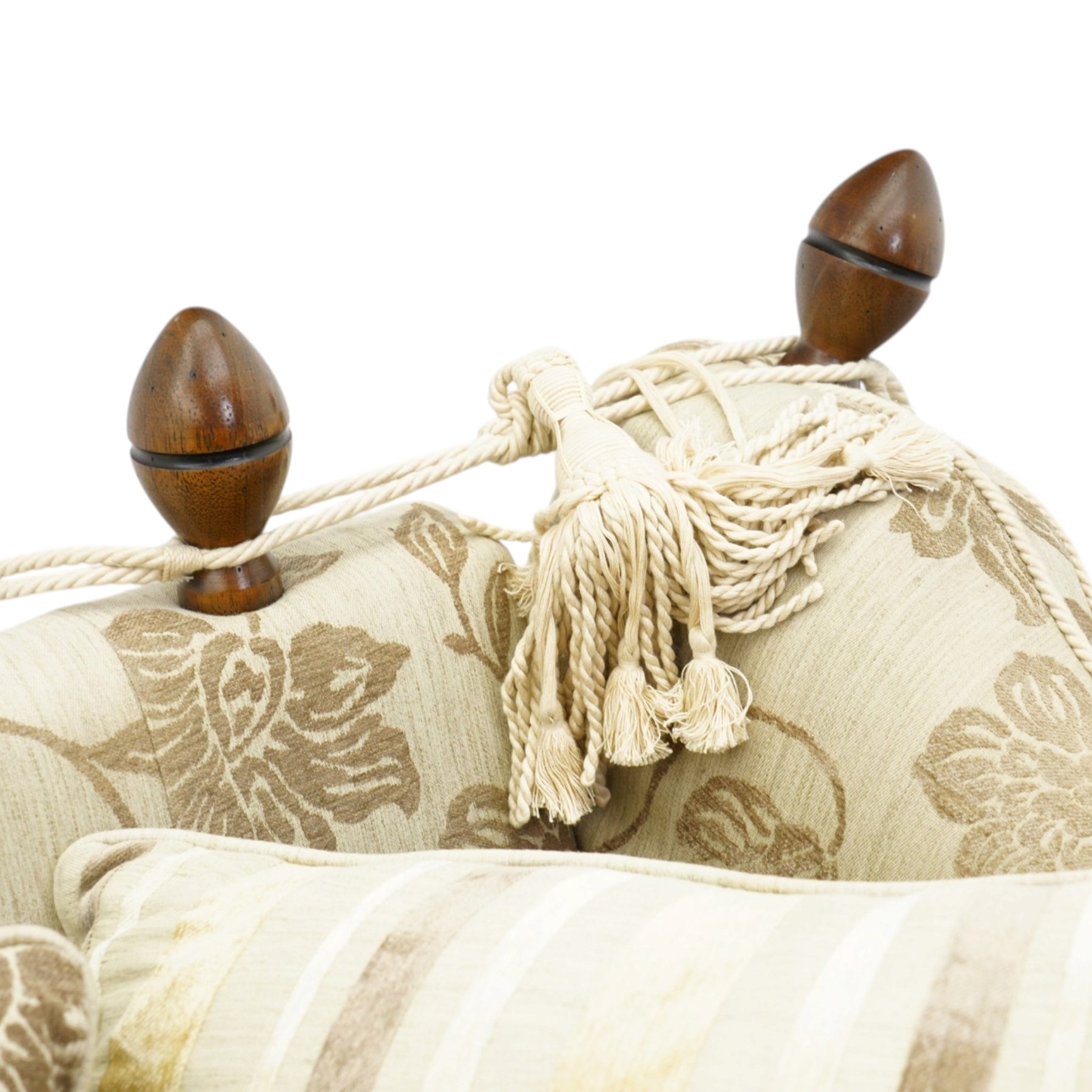 Traditional knoll sofa, upholstered in cream and olive floral fabric, adjustable drop ends secured by cords to turned finials, loose seat and back cushions with piped edges, on square tapering feet, with four scatter cushions