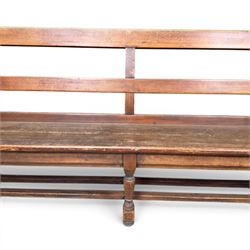 Early 20th century pine and oak bench seat, stained pine rail back frame with shaped oak arms