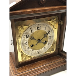  Edwardian oak architectural cased bracket clock, silvered Roman dial with twin train movement half hour striking on a coil, H34cm, W28cm, D17cm   