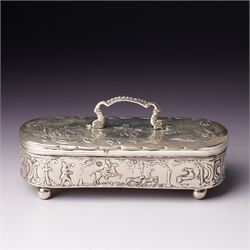 19th century continental silver box of oval design , the hinged cover with swing handle em...