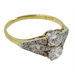 Early-mid 20th century two stone diamond ring, with diamond set shoulders, stamped 18ct, two principle diamonds approx 0.65 carat total