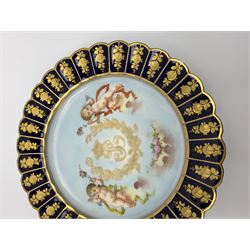 Mid 19th century Sevres Louis Philippe period porcelain cabinet plate, decorated with central Louis Philippe crowned monogram flanked by two cherubs, within cobalt gilt detailed border, with date mark for 1846, red inventory mark for Chateau des Tuileries, and blue monogram mark , D14.5cm