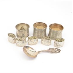 Norwegian silver spoon, with circular bowl and pierced floral handle, stamped 830S NM, for Magnus Aase, Norway, together with eight German silver napkin rings, including pair with engraved floral decoration, embossed example and five small fluted examples engraved with initials, all stamped 800 with crescent moon and crown marks