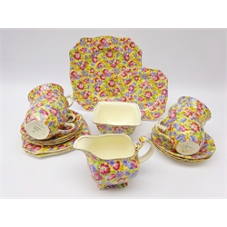  Royal Winton Grimwades 'Royalty' pattern tea set comprising six cups and saucers, four tea plates, milk jug, sugar bowl and cake plate with 'The Chintz Collectors Handbook and Price Guide' by Francis Joseph   