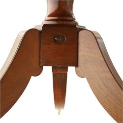 Acornman - mahogany twin pillar extending dining table, strongly grained top with inlaid edge, raised on a ring turned baluster column, above three swept supports terminating in brass paw feet above castors, two additional leaves extending the table to 242cm, with signature carved acorn, by the workshop of Alan Grainger of Brandsby