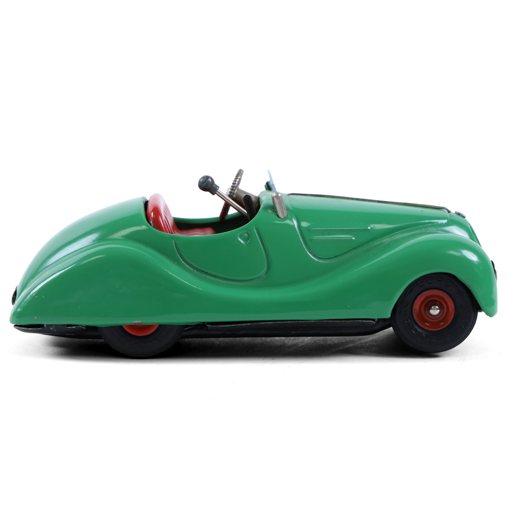 Schuco Examico 4001 tinplate clockwork car, in green with red interior, with key