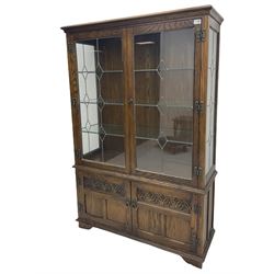 Old Charm oak glazed bookcase, fitted with two leaded doors and two cupboards