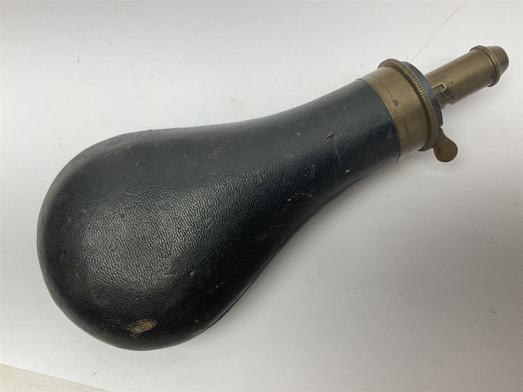 19th century James Dixon & Sons leather covered powder flask with patent action adjustable shot measure to dispense 2 1/4 - 3 drams; marked Parker Hale Ltd. Birmingham England L20cm