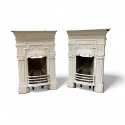 Two Victorian small cast iron fireplaces in a white finish
