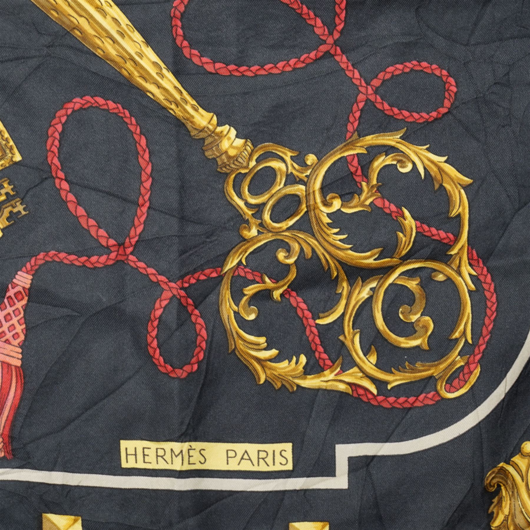 Hermes 'Les Clefs' silk scarf, in the black red and gold colourway, designed by Cathy Latham, 86cm x 86cm