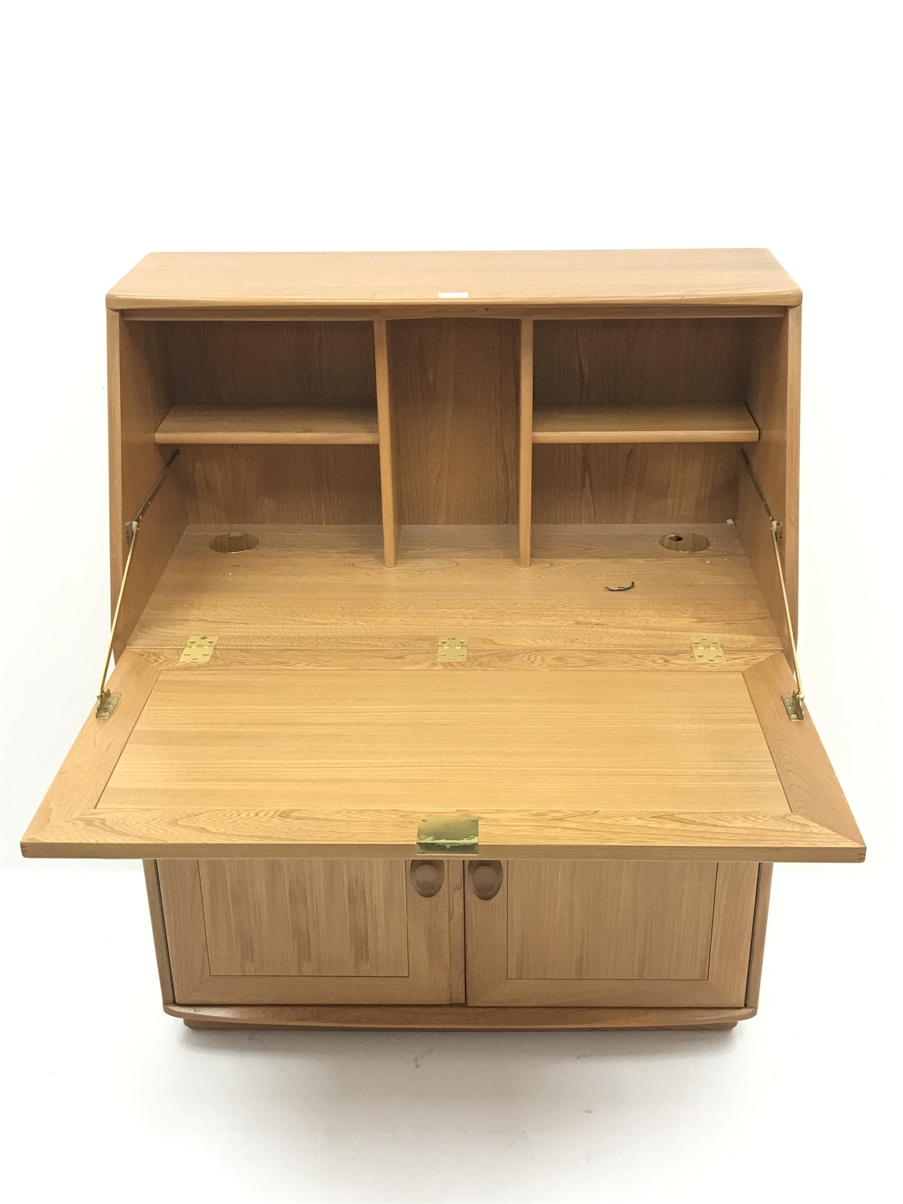 ercol light elm bureau, sloped fall front above drawer and double