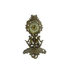 British united clock company - early 20th century English timepiece mantle clock, with a decorative brass case depicting putti, ivorine dial with Arabic’s and an embossed brass centre, movement wound and set from the rear.