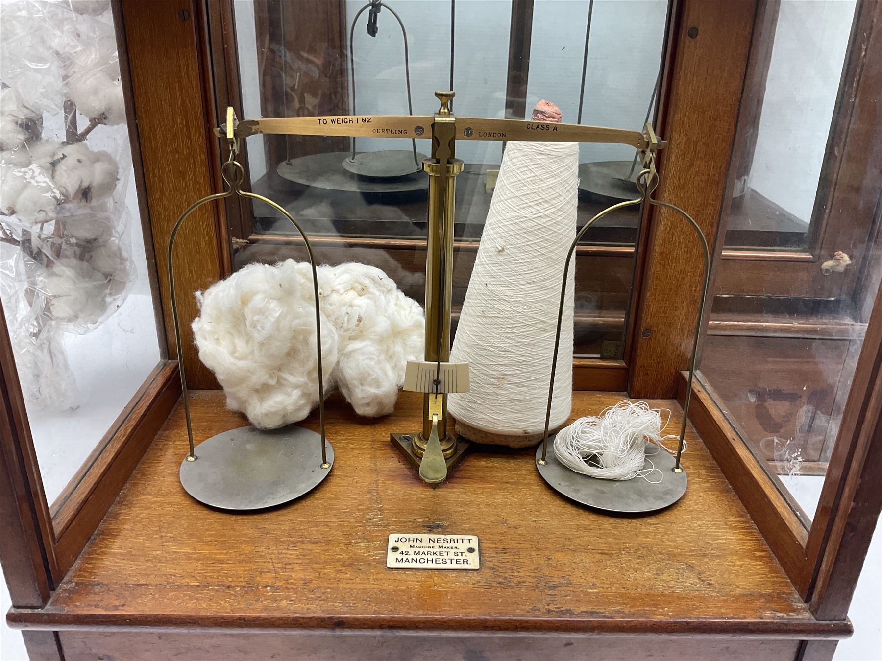 Collection of textile equipment, comprising, Goodbrand & Co. mahogany and brass yarn tester, Negretti & Zambra barograph and two sets of precision scales