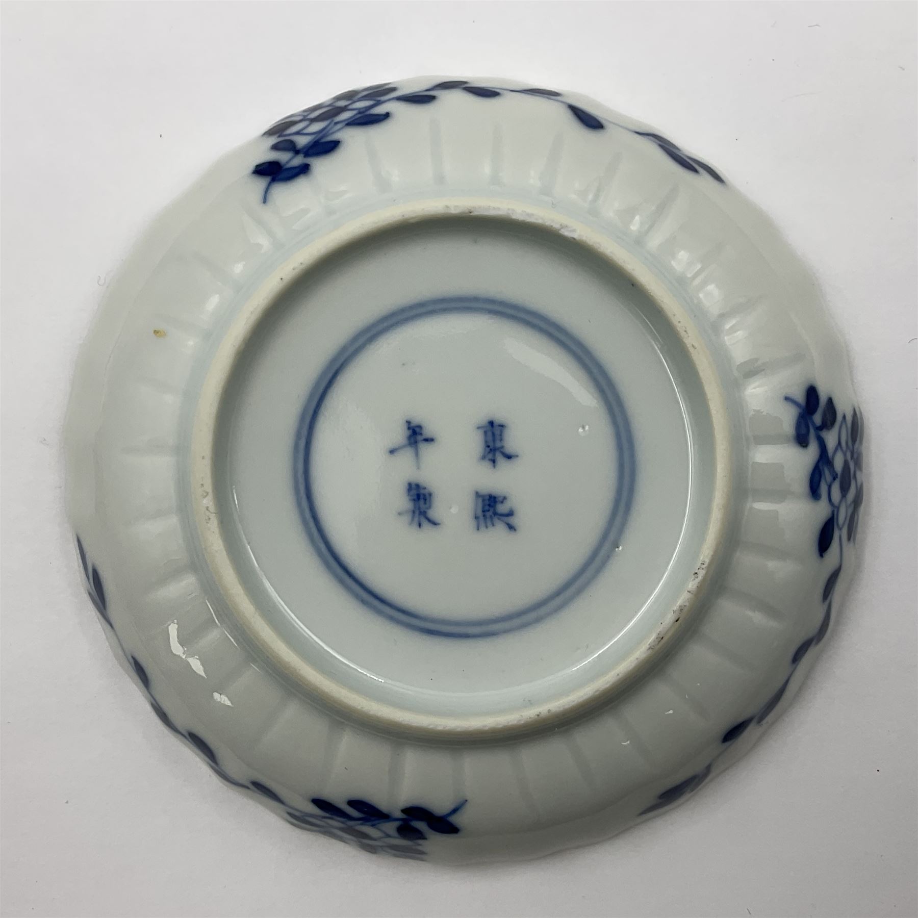 18th century Chinese blue and white Kangxi teacup and saucer, decorated with dancing figures, four character Kangxi mark beneath, saucer D10cm