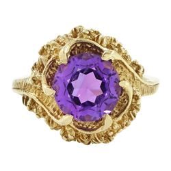 9ct gold amethyst single stone ring, round cut amethyst set within a pierced textured surr...