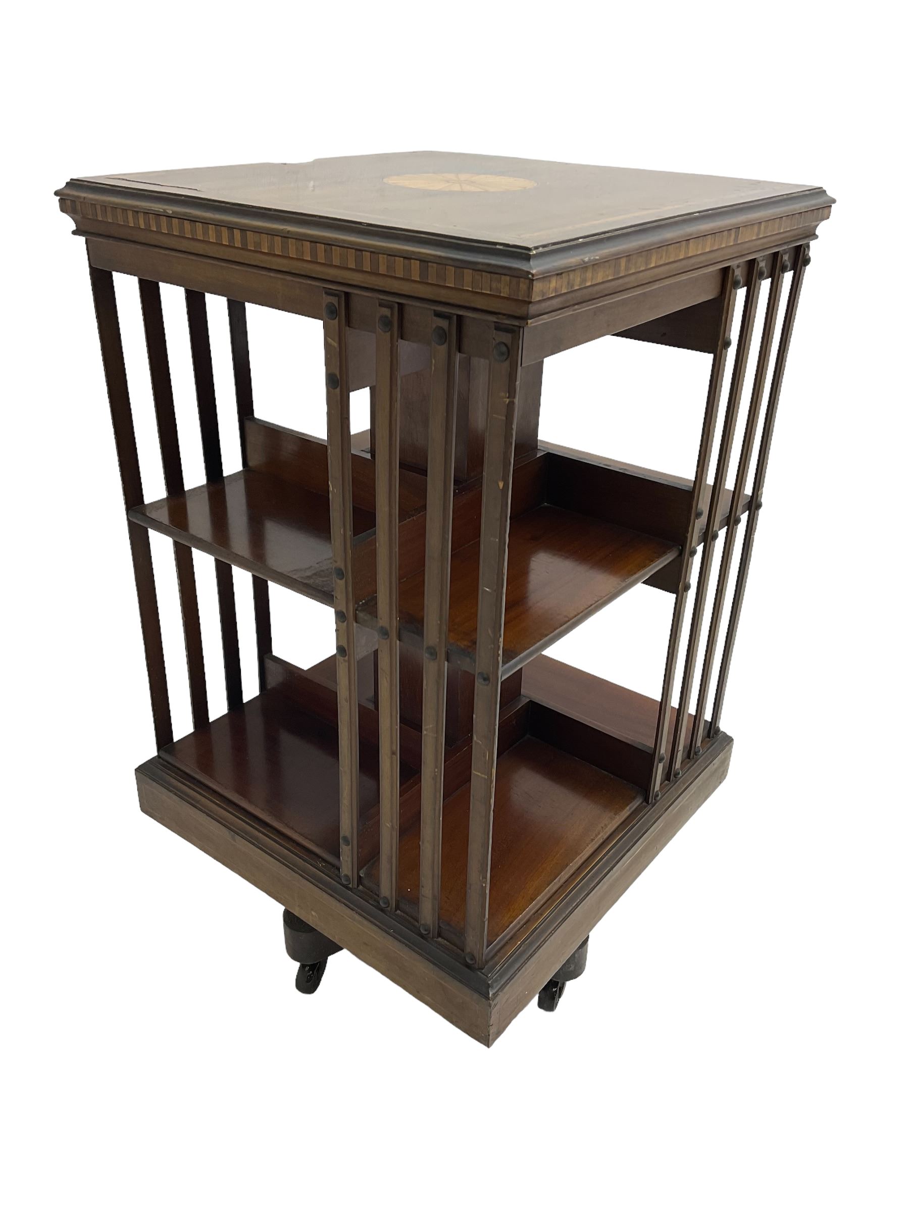 Maple & Co. London - Edwardian mahogany inlaid revolving bookcase, moulded square top with inlaid circular fan motif and satinwood banding, with circular label