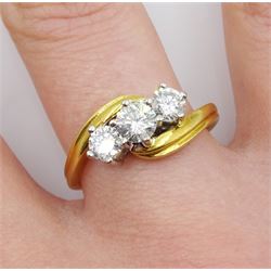 18ct gold three stone round brilliant cut diamond crossover ring, hallmarked, total diamond weight 0.75 carat