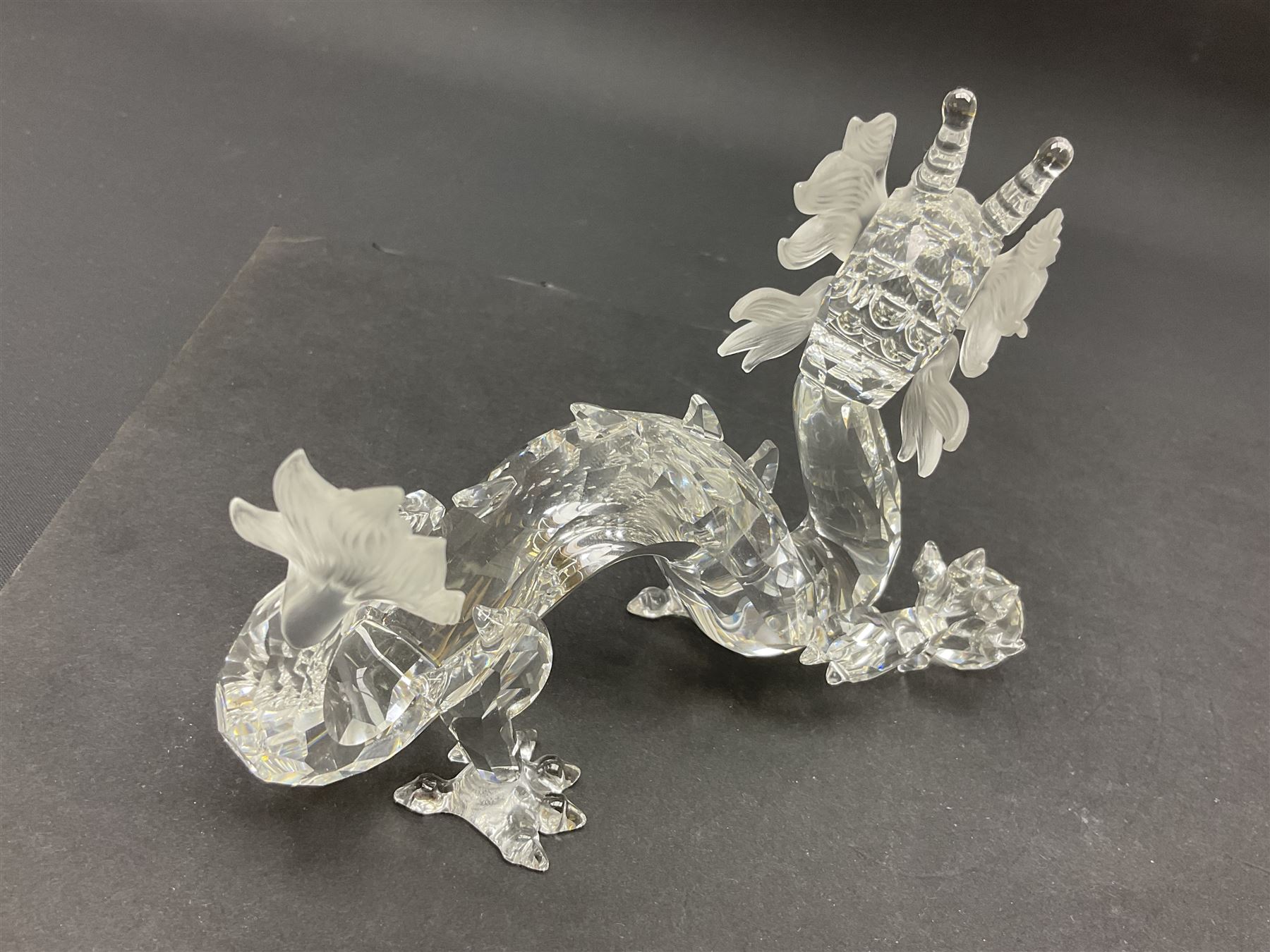 Two Swarovski Crystal Signs of the Zodiac figures, comprising horse and tiger, together with Zodiac dragon holding the flaming pearl, largest H11cm 