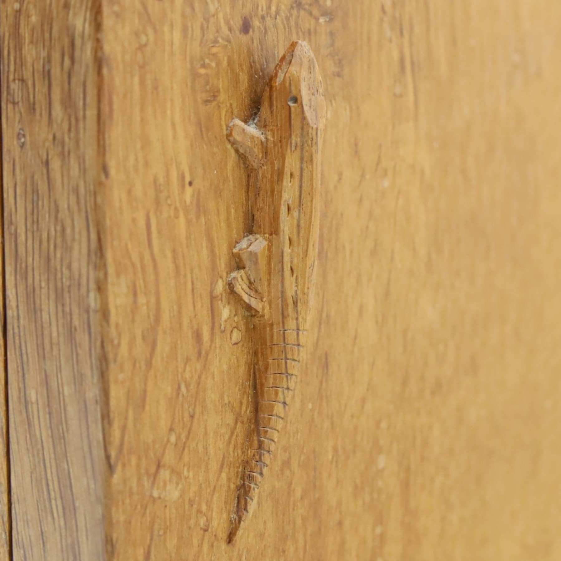 Lizardman - adzed oak media cabinet, adzed rectangular top above twin doors enclosing a shelved interior, above a fall front drawer, Yorkshire Rose carved handles, raised on castors, with carved lizard signature, by Derek Slater of Crayke  