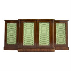 19th century mahogany break-front sideboard, raised brass gallery back with Greek key design, fitted with four cupboard doors, their pleated green fabric overlain with gilt metal grilles, lower moulded edge over plinth base
