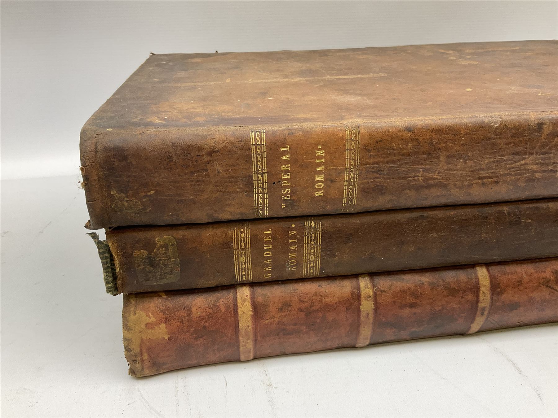 Six 19th century leather bound books of music comprising Graduale Juxta Missale Romanum and Antiphonarium Romanum. Both 1828 Divione; Graduel Romain and Psautier Romain. Both 1859 Digne/Paris; Graduel Romain. 1872 Marseille; and Missale Romanum. 1853 Mechliniae (6)