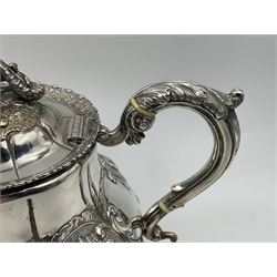 Victorian silver three piece tea service, comprising teapot, twin handled open sucrier, and milk jug, each of bellied form with acanthus capped scroll handles, the sides embossed with alternating scroll edged vacant panels and panels containing a pair of birds, upon four palmette feet, the teapot with ivory insulators to handle, and bird finial to the hinged domed cover, hallmarked William Hunter & Son, London 1861, teapot H19cm, including handles sucrier H13.5cm, including handle milk jug H12cm

This item has been registered for sale under Section 10 of the APHA Ivory Act