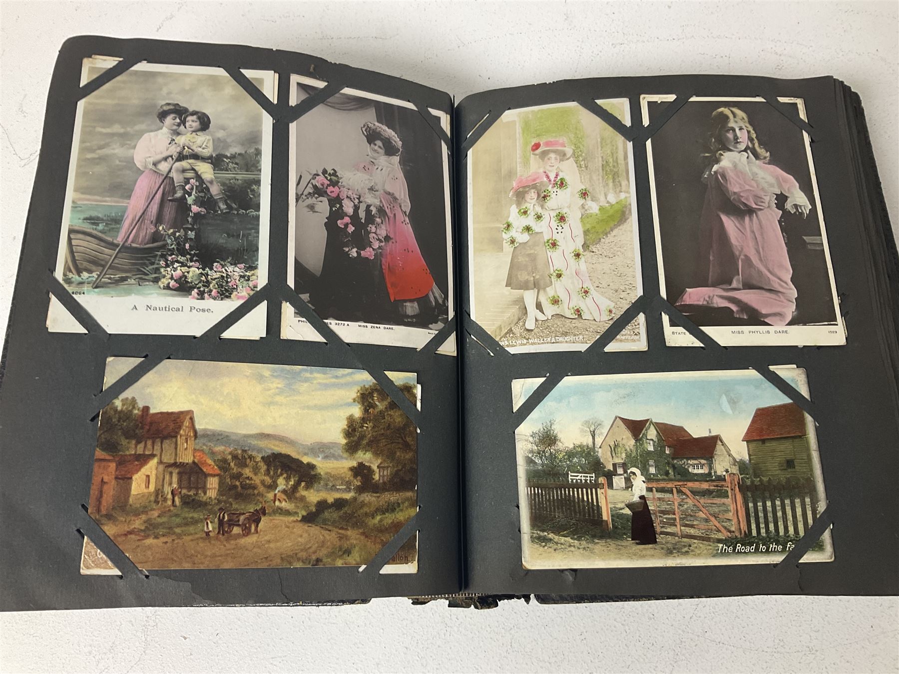 Postcard album with Victorian and later postcards, including silk cards, landscapes of the UK, portraits, Christmas cards etc  